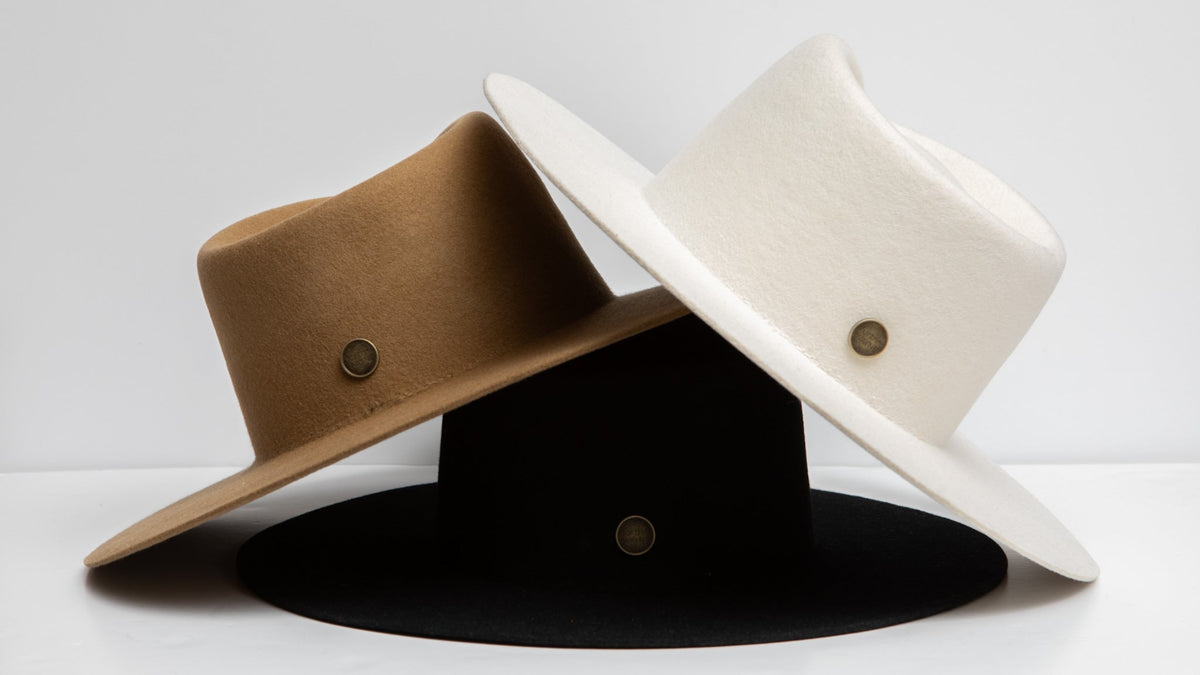 The Moment Collection — three wide-brim fedoras